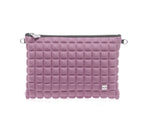 una borsetta da donna della collezione BPrime Bags, modello clutch, realizzata con il tessuto riciclato termoformato 3D Cube, con chiusura a zip logo BPrime in metallo, color verde militare.